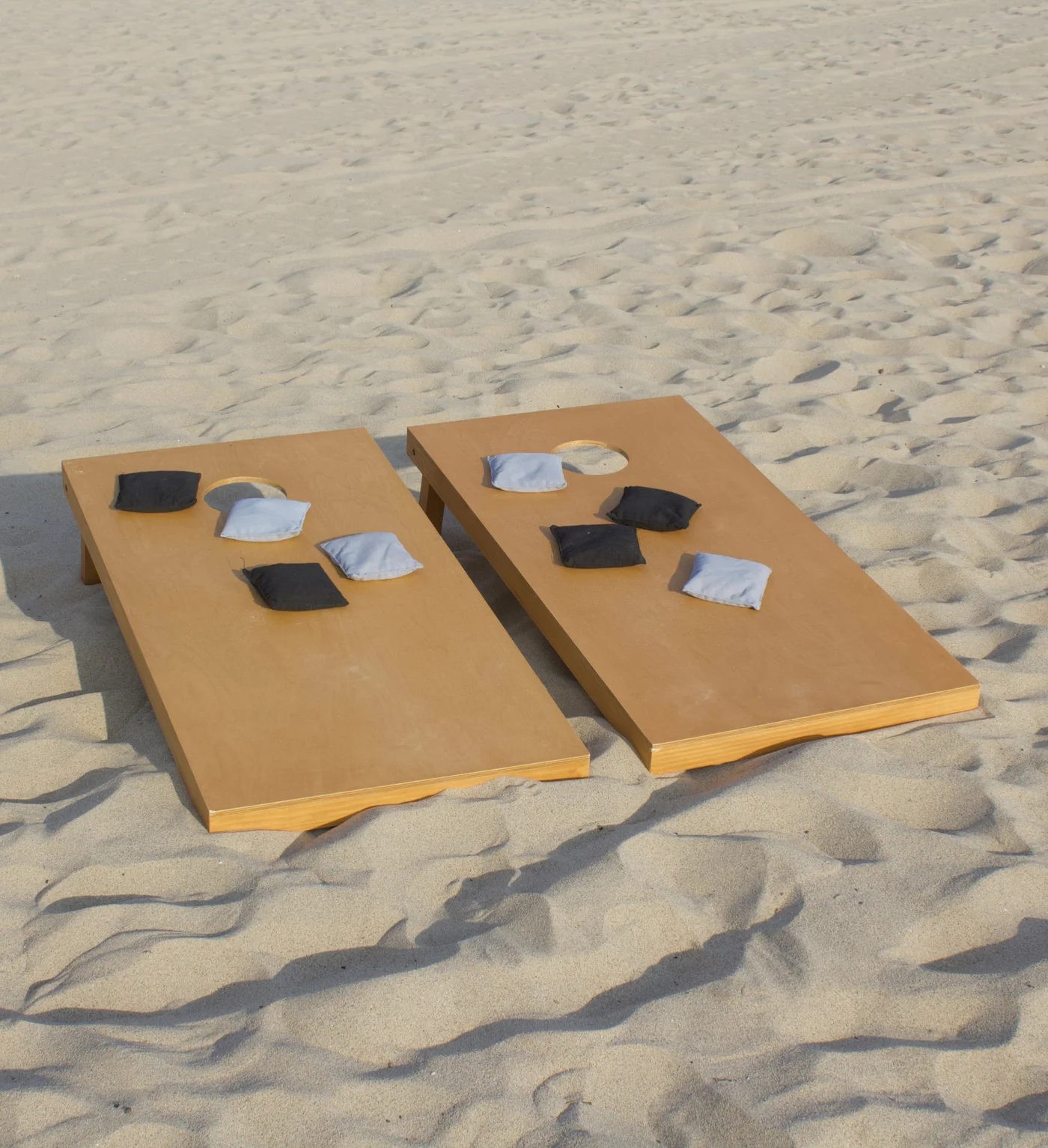 Cornhole boards set up on the beach